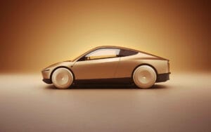 Carro autônomo da Tesla com design futurista e elegante, exibindo linhas suaves e acabamento em tom bronzeado.